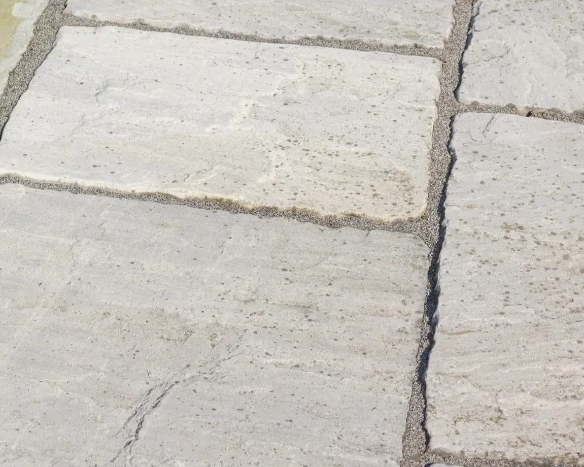 Stone tiles with textured gray surface.