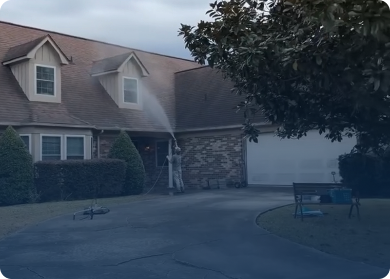 Firefighters respond to a smoke-filled house at dusk.